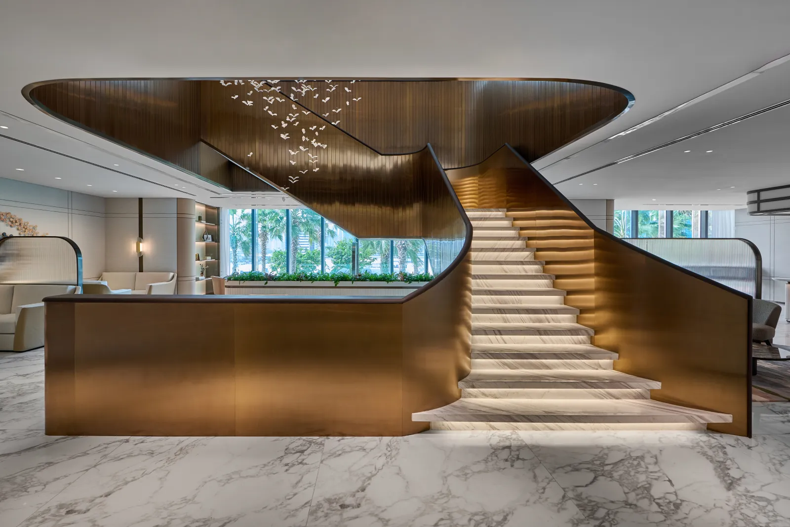 Grand golden stair case with marble like illuminated stairs